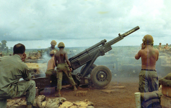 "The Undertaker"
The tube is named the "Undertaker".  Everyone wanting to file a VA tinnitus claim: Take Note!  See the safety ear plugs being used by the Cannoneer at right front?  I don't either!  The crew is firing the newer M102 Howitzer.

