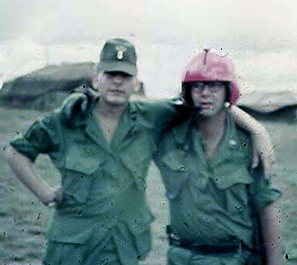 Forward Observers Lt Dave Whaley with Lt Bob Bagwell, still wearing a flight helmet.
