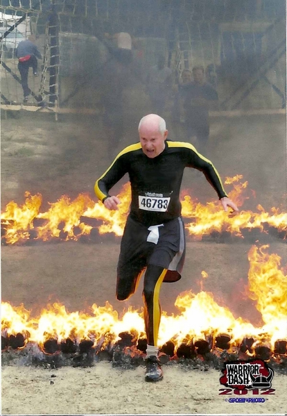 Fire Mission?
There's the old saying about "When the dog hears the Fire Bell....".  Don thought he heard someone yell "Fire Mission" and ran through the fire.  That happens when you get older.
Actually, it was the insanely-popular "Warrior Dash" held in Jackson, MS on 4/21/12, a 5K race that includes a military-style obstacle course.  It is connected with the St Jude charity.  Yes, Don finished on the same day, and no, he did not wet his pants.  That's just his Geezer outfit.
