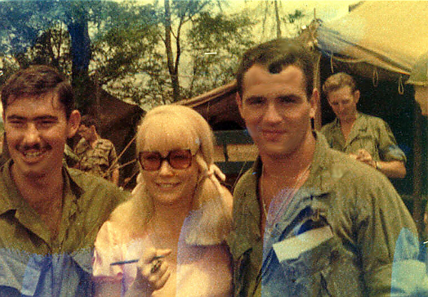Can I keep her?
Jim "Tex" Shelton and Mike Medley surround Chris Noel, model, singer and actress who visited their LZ.  Ms Noel was honored with an award for her support visits in Vietnam.
