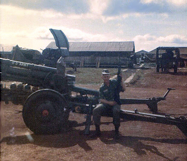Base Camp - Christmas, 1966
My howitzer.  Note the radar unit in background.

