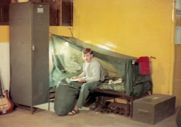 June, 1969
Got the mailroom job and this is my bunk area, complete with standing GI metal locker, wooden footlocker, and mosquito mesh over bunk.  Next photo is Steven Brown, the guy who went home and I got his job.
