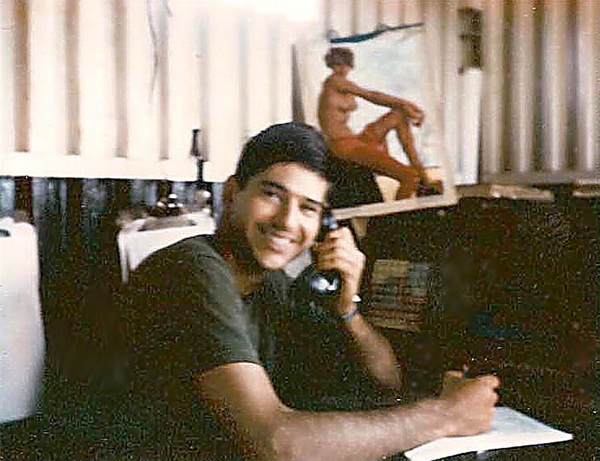 "Yeah, I'm talking to my girl"
Date: 22Oct68  Location: 40 mi S of Ban Me Thuot; 5 mi from Cambodia and the NVA.   Working hard as always in the "Home Sweet Home" bunker.  Notice the definite look of tension from the war.  Actually, this is a quiet moment in the FDC shack (CONEX).  
