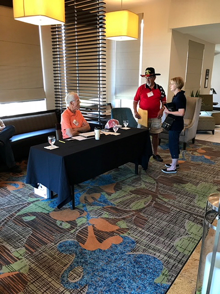 Arrival Day, May 9, 2018
2/9th FA Webmaster Dennis Dauphin and wife Jackie check in at the Registration Desk with John "Moon" Mullins.  The "Grand Finale" rooms were booked with the Hilton Garden Inn in downtown Lawton, close to Ft Sill, OK.

Photo courtesy of Wayne Rayfield
