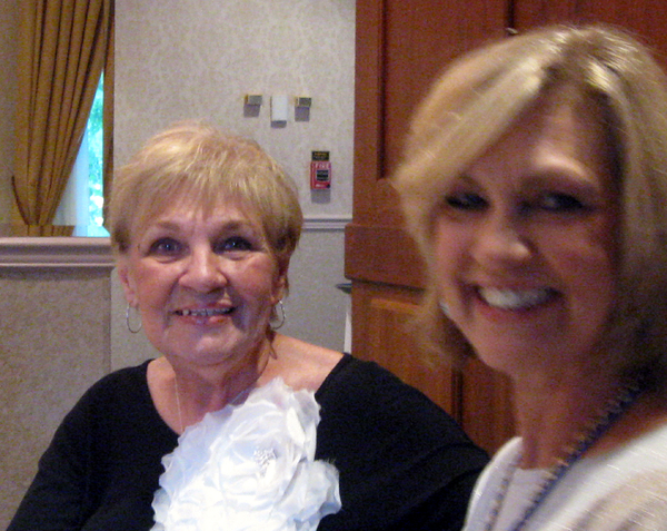 Joint Dinner - C-1-35 & 2/9th
Barb Keith and her daughter Cindi Strong give big smiles at their dinner table.
