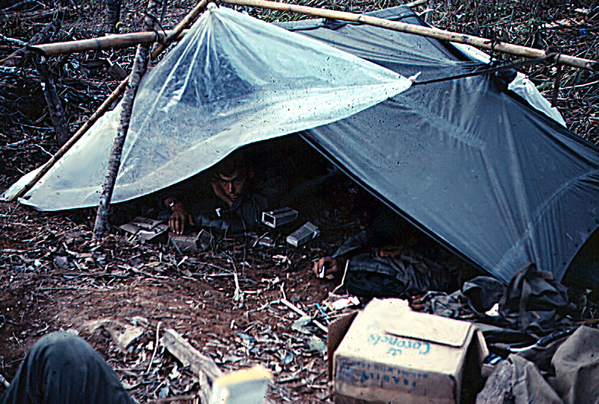 Life in the field
Low-level tent provides basic cover.
