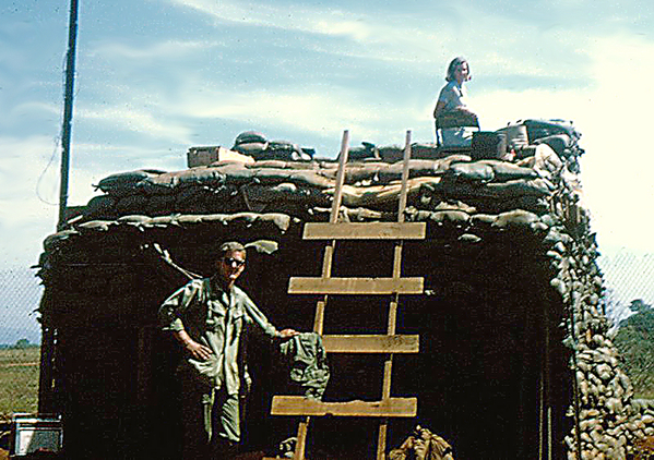 Getting a better view
Jenny climbed to the top of the sandbagged structure (FDC?) to get a better view.  Jenny visited several firebases in the FIELD, not sitting in the rear areas like a lot of well-publicized celebrities who went to Vietnam.  Jenny and her cohorts were brave enough to go meet the men who did the fighting, not the ping-pong players in the rear.  She feels pretty sure that this photo was taken at LZ St George.
