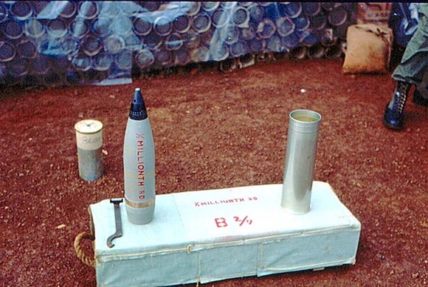 The 500,000th 105mm round fired in combat
B/2/9 holds the distinction of firing the "1/2 Millionth" round in Vietnam.  Looks like they chose a Willy Peter round.  Good choice.  Photo by Terry Stuber; contributed by J. William Ward. That "broken wrench" was the latest technology in setting a time fuze.  The benchmark round was fired from LZ Uptight.
