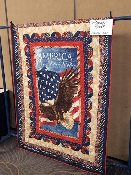 A very nice prize!
This beautiful handmade quilt with the eagle and the flag was raffled off at the closing banquet.
