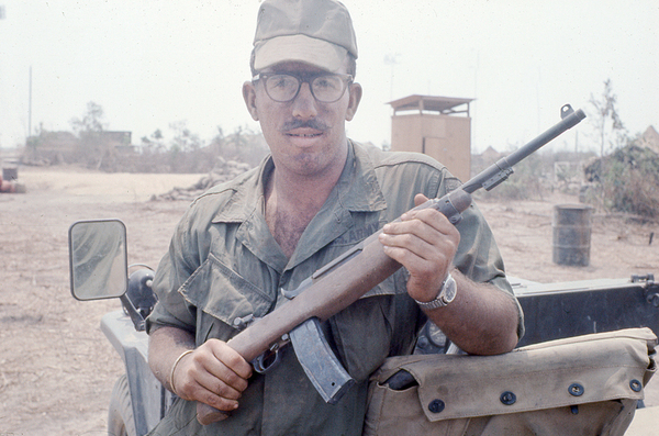 Armed and Ready
Ron holding a sawed-off carbine.  He saw service with an FO Party and later moved into the FDC crew shifts with Lt Wayne T. Crochet and Sp4 Jack Boston.  Ron had a good working knowledge of FADAC.
