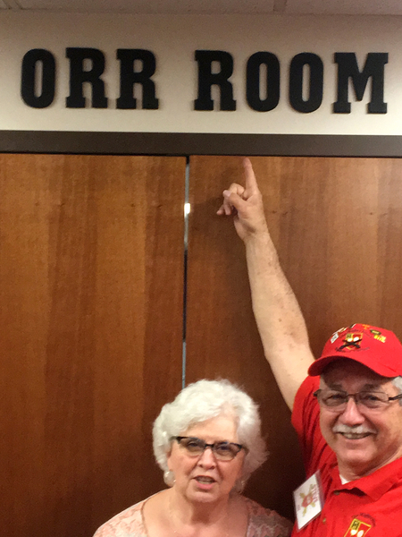 The Orr Room
Steve points to the sign honoring Jerry Orr, a former member and favorite son of the 1/19th FA Training Battalion.

Photo courtesy of Steve Cox
